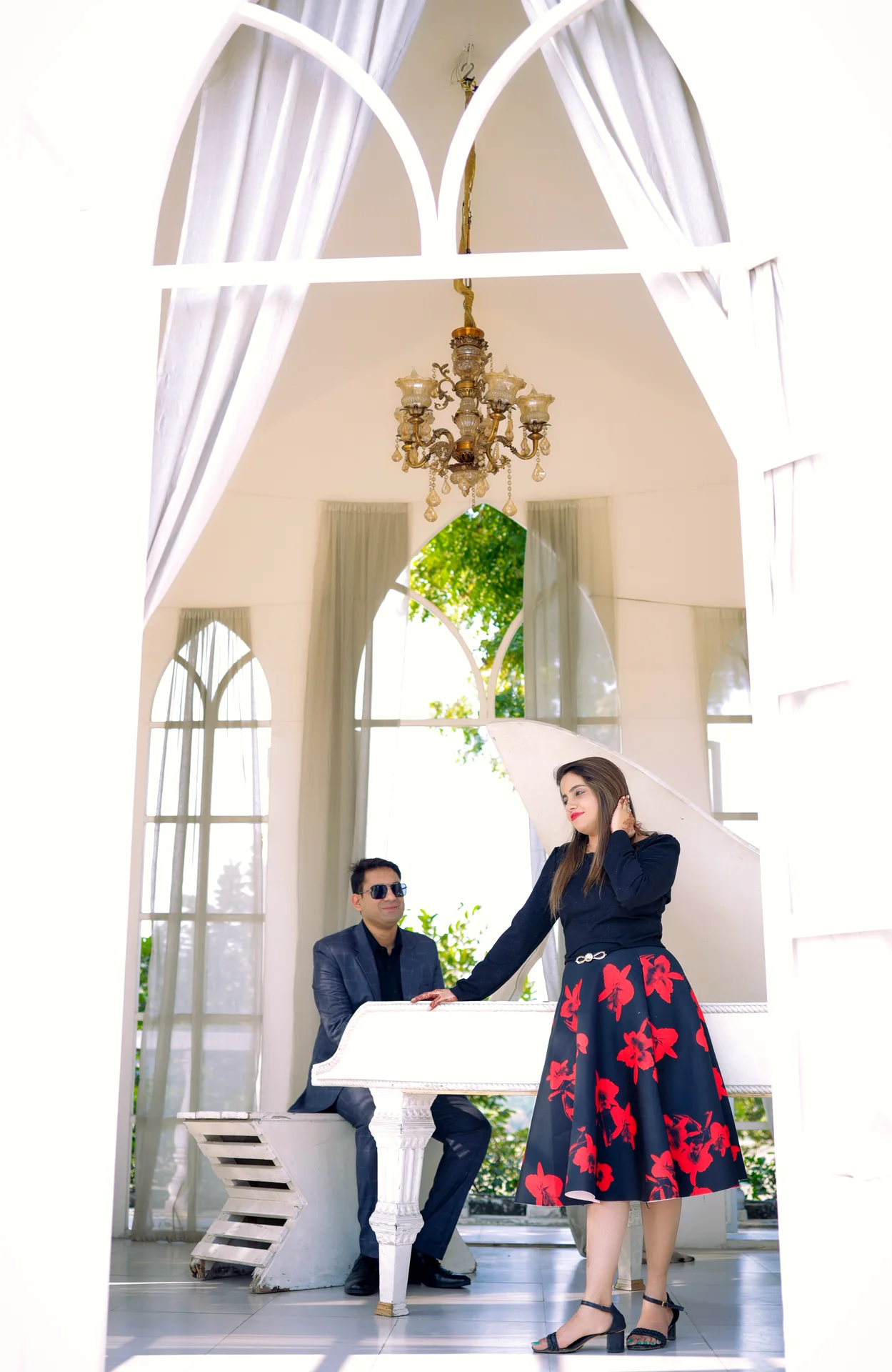 Couple sharing an unscripted embrace and genuine smile during pre-wedding session (Frame #5)