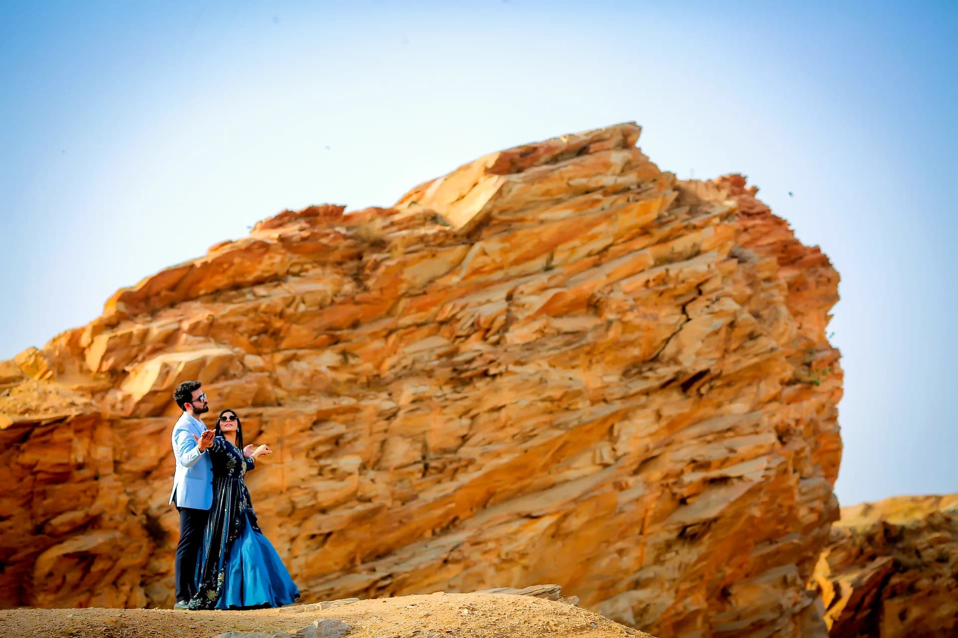 High-fashion bridal portrait in elegant flowing evening gown during pre-wedding photography (Frame #7)