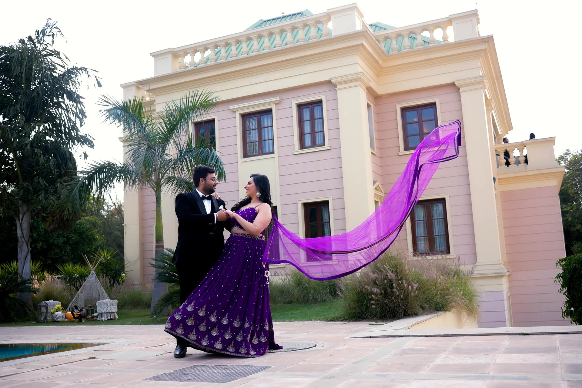 Couple sharing an unscripted embrace and genuine smile during pre-wedding session (Frame #17)