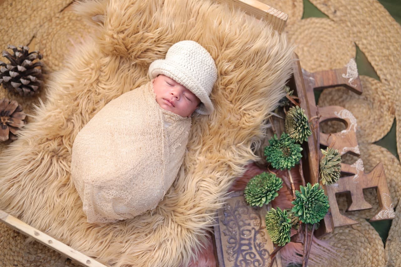 Newborn baby resting safely in cozy nest setup