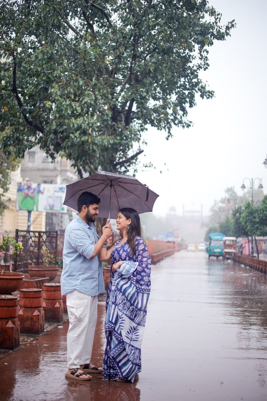 Couple walking through heritage lanes during pre-wedding shoot in Delhi.