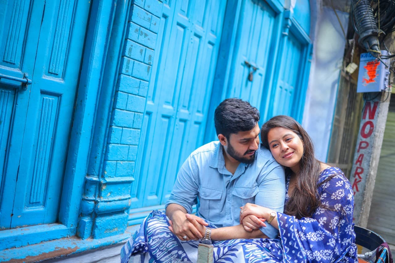 Couple sharing a playful moment during pre-wedding shoot.