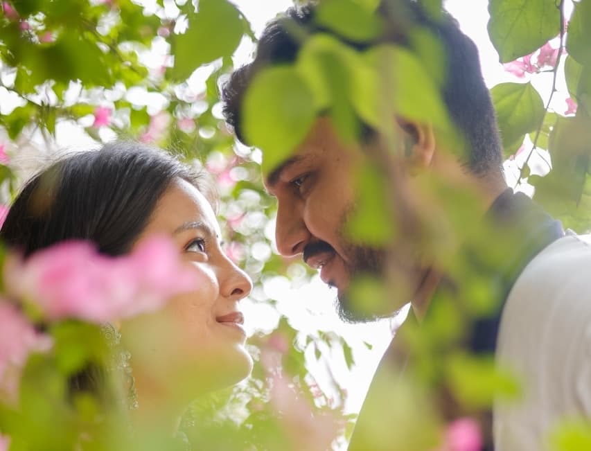 Close portrait of couple during cloudy day pre-wedding shoot.