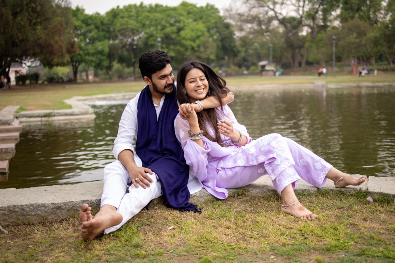 Couple laughing together in candid pre-wedding moment.
